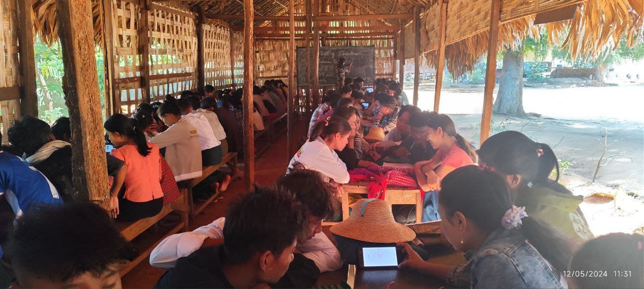 Mixed-age learners studying together in a community classroom